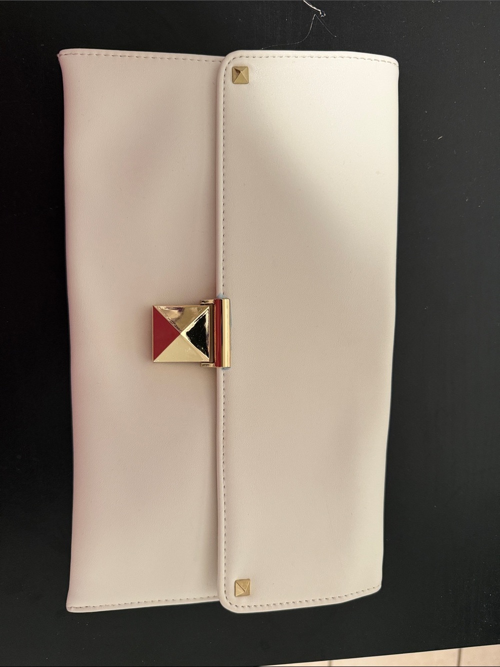 Elegant Cream Leather Clutch with Gold Pyramid Accent